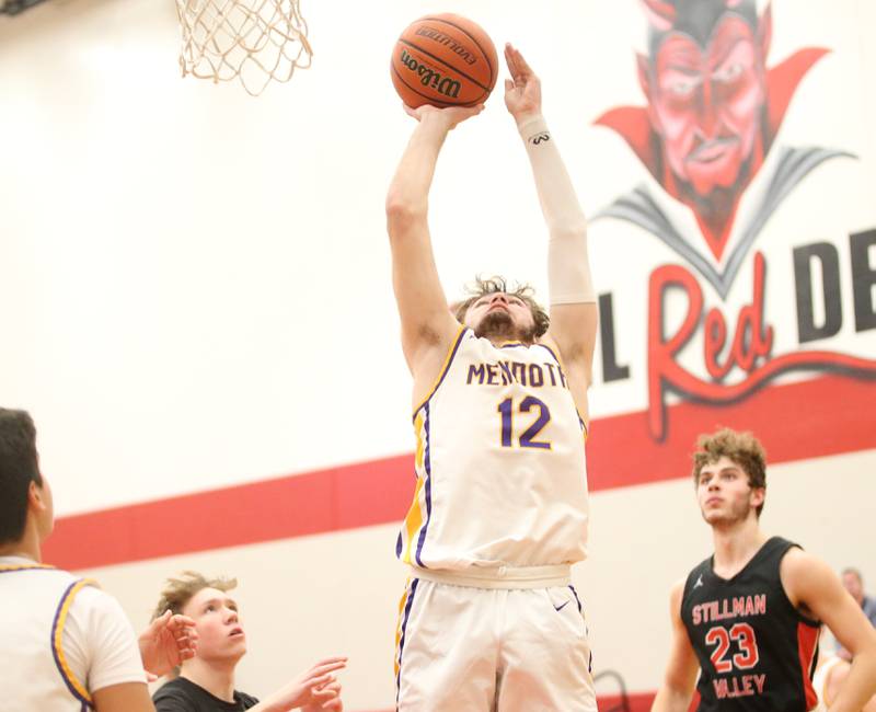 Mendota's Braiden Freeman posts up on the lane to score a basket against Stillman Valley during the 49th annual Colmone Classic Tournament on Wednesday, Dec. 6, 2023 at Hall High School.