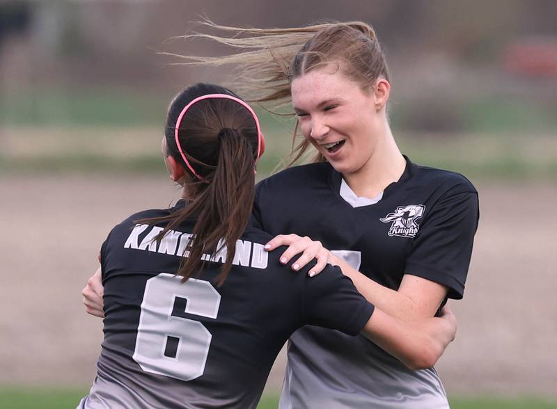Kaneland's Olivia Davis (right) celebrates with teammate Taylor Mills after scoring her third goal of the game against Sycamore Monday, April 13, 2026, at Kaneland High School.