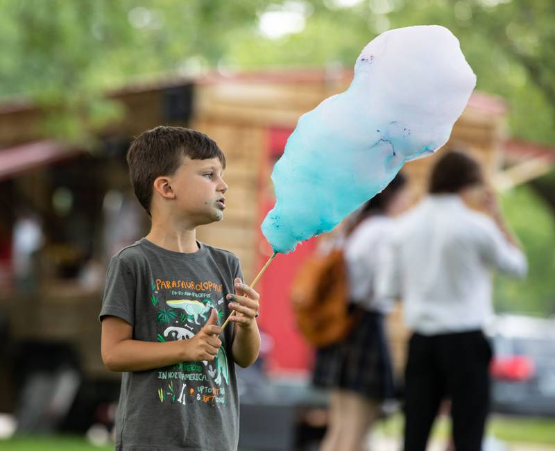 Zachariah Mashal (5) eats candy during the Voyage en France Fest at Cantigny in Wheaton on Sunday, July 16, 2023.