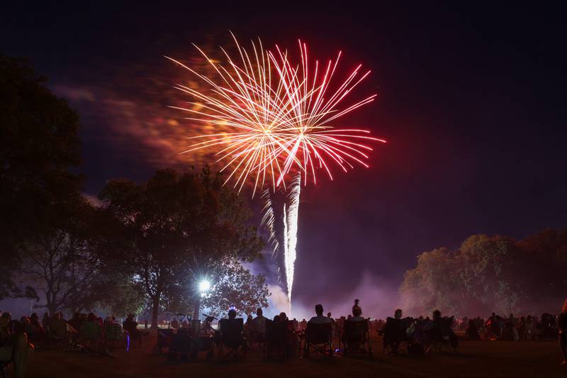 Spectators watch the city of Kankakee's fireworks show at Kankakee Community College on Friday, July 4, 2025.