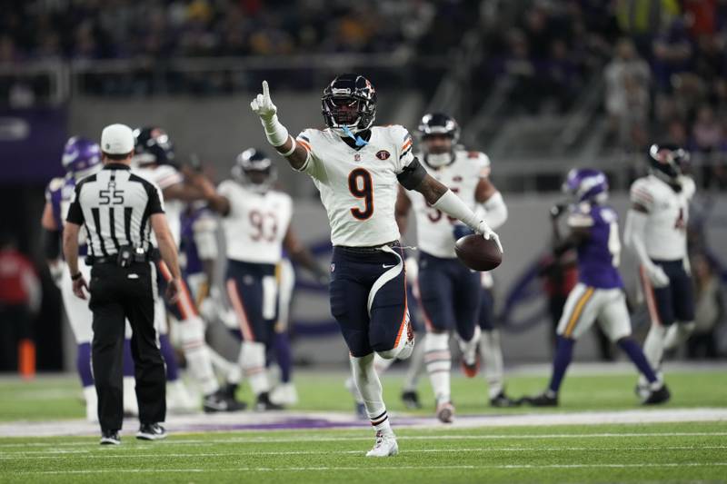 Chicago Bears safety Jaquan Brisker (9) celebrates after intercepting a pass during the first half of an NFL football game against the Minnesota Vikings, Monday, Nov. 27, 2023, in Minneapolis. (AP Photo/Abbie Parr)
