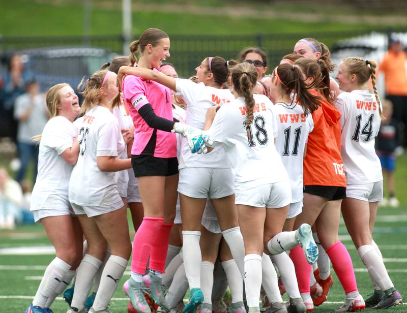 Wheaton Warrenville South players celebrate their Class 3A Glenbard West Sectional final win against St. Charles North on Friday, May 30, 2025 in Glen Ellyn.