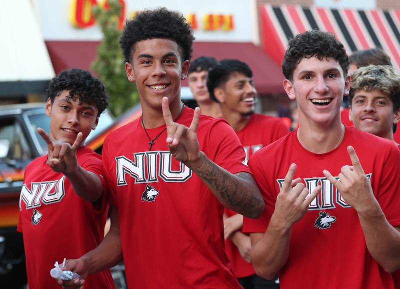 Northern Illinois University student athletes march in the parade Thursday, Oct. 2, 2025, during the Huskie Homecoming Block Party in downtown DeKalb.