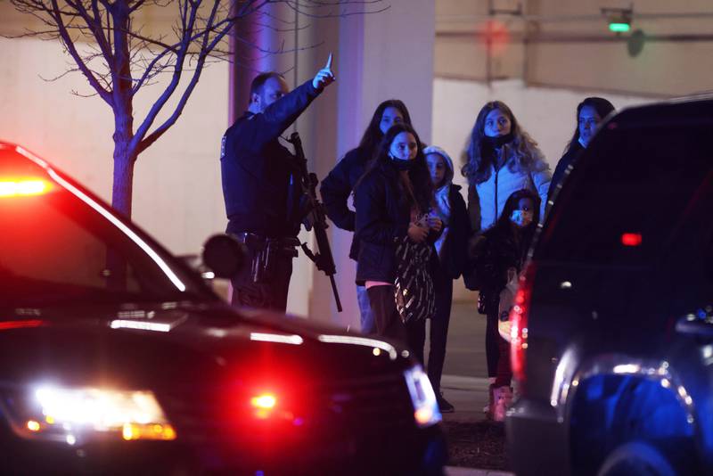 Oak Brook Mall was placed under a lockdown after calls of shots fired, Thursday, Dec. 23, 2021, in Oak Brook, Ill. A shooting at the suburban Chicago mall full of Christmas shoppers left several people injured Thursday, police said. The incident at Oakbrook Center in Oak Brook began with two males involved in a shootout in a corridor around 5:45 p.m., police Chief James Kruger said. (Anthony Vazquez/Chicago Sun-Times via AP)