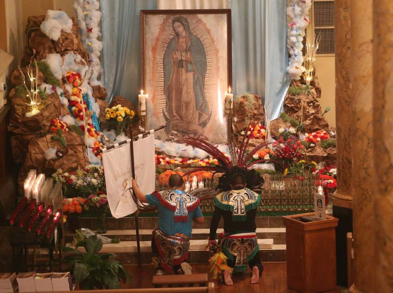 Parishioners pray during the Lady of Guadalupe event on Tuesday, Dec. 12, 2023 at St. Hyacinth Church in La Salle. Our Lady of Guadalupe, also known as the Virgin of Guadalupe, is a Catholic title of Mary, mother of Jesus.