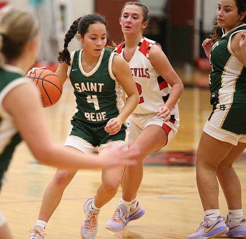 St. Bede's Kristal De La Torre (4) runs into the lane as Hall's Kennedy Wozniak (22) defends on Monday, Nov. 28, 2022 at Hall High School in Spring Valley.