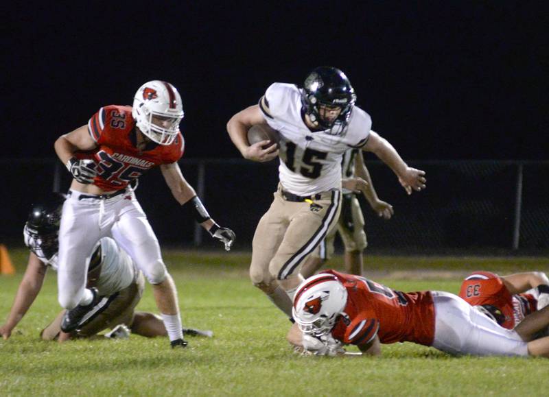 Lena-Winslow's Koby Kearns looks to avoid two Forreston defenders on Friday, Aug, 29, 2025 at Forreston High School.