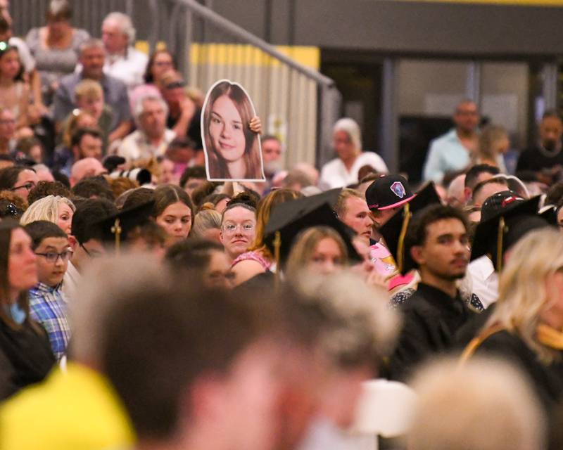 A Sycamore attendee holds up a poster during the graduation ceremony on Sunday May 24, 2026, held at Sycamore High School.