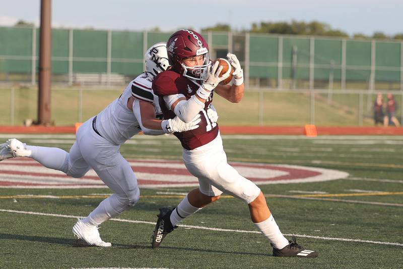 Lockport’s Brendan Mecher pulls in a pass against Plainfield North on Friday, August 30, 2024 in Lockport.