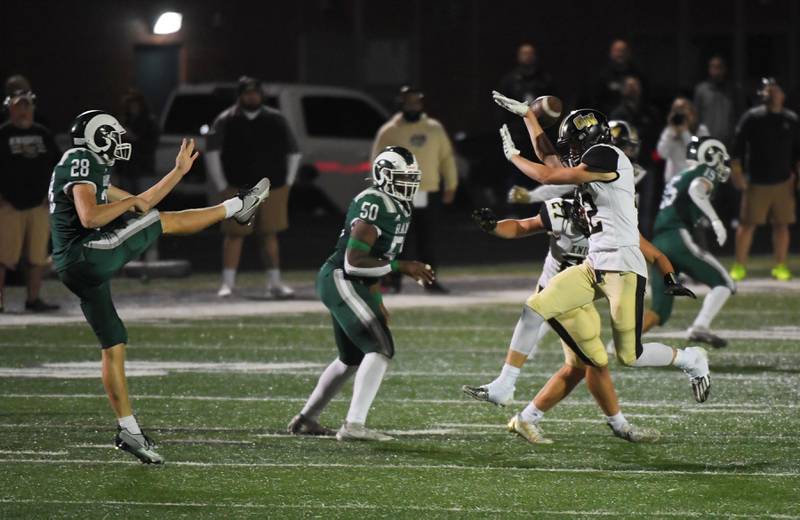 Grayslake North’s Chris Filas jumps to block a punt by Grayslake Central’s Connor Flood in a football game at Central High School on Thursday, September 14, 2023.