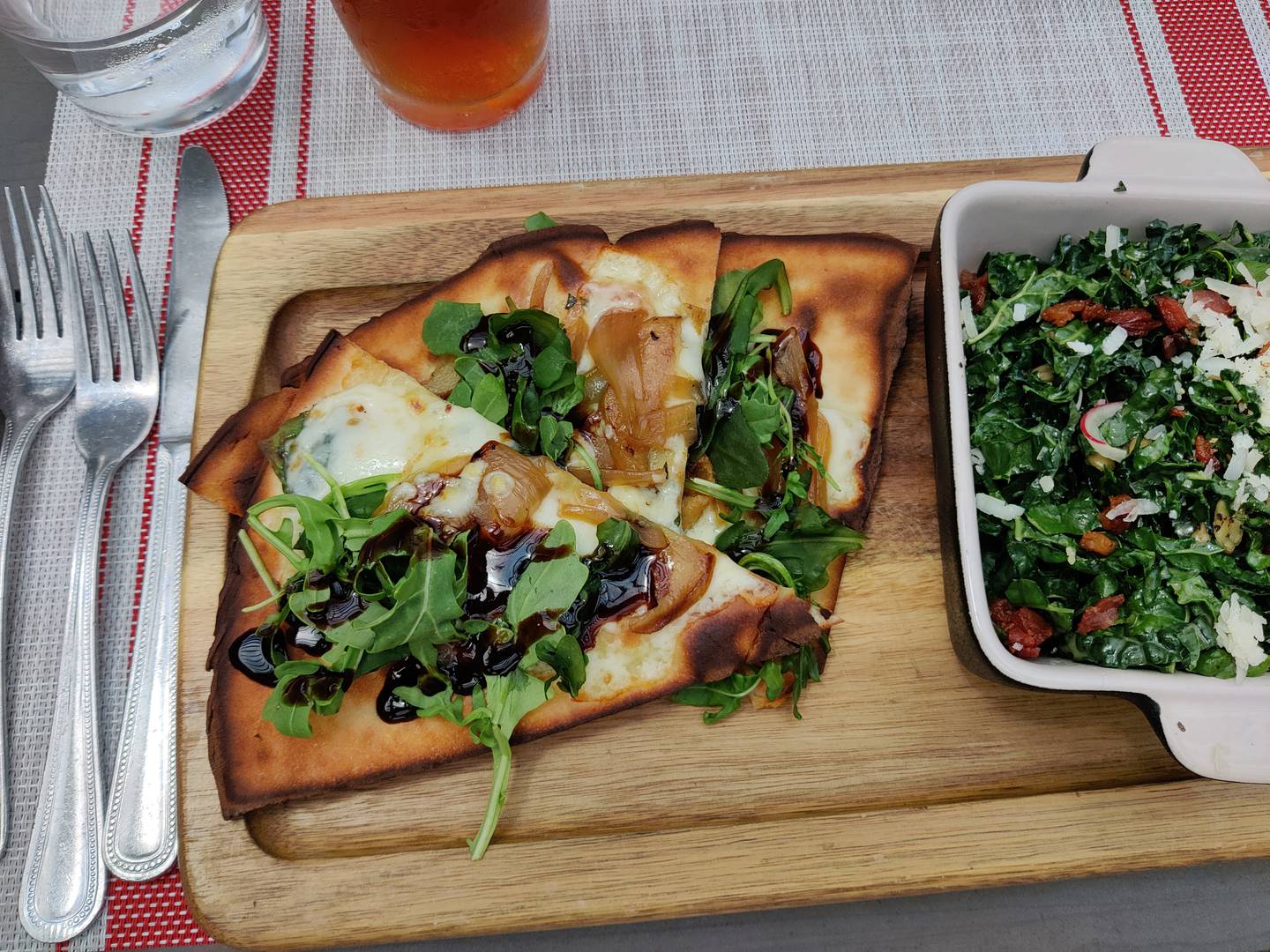 Gluten-free, wood-fired pizza and a side salad in the luncheon special at Gia Mia in Geneva.