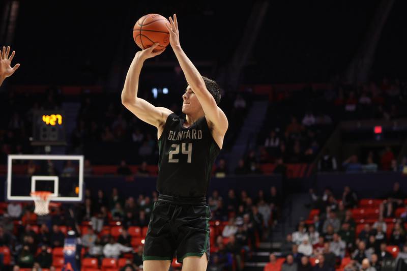 Glenbard West’s Paxton Warden puts up a shot against Bolingbrook in the Class 4A semifinal at State Farm Center in Champaign. Friday, Mar. 11, 2022, in Champaign.