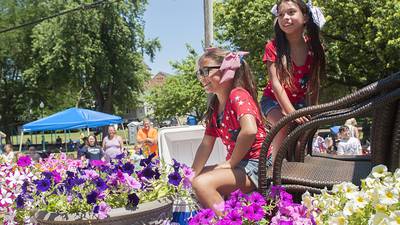 Dixon parade festooned with red, white, blue — and petunia pink
