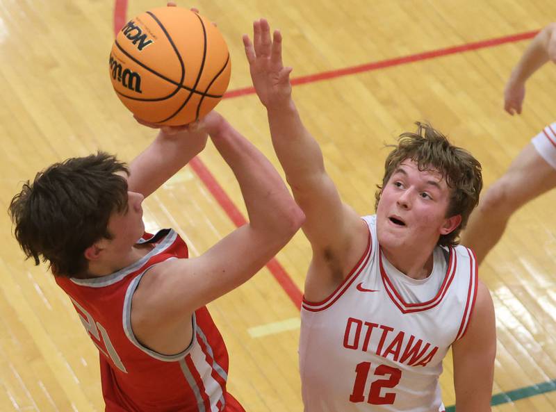 Streator's Brennen Stillwell lets go of a jump shot over Ottawa's Jack Carroll during the Class 3A Regional semifinal game on Wednesday, Feb. 25, 2026 in Sellett Gymnasium at L-P High School.
