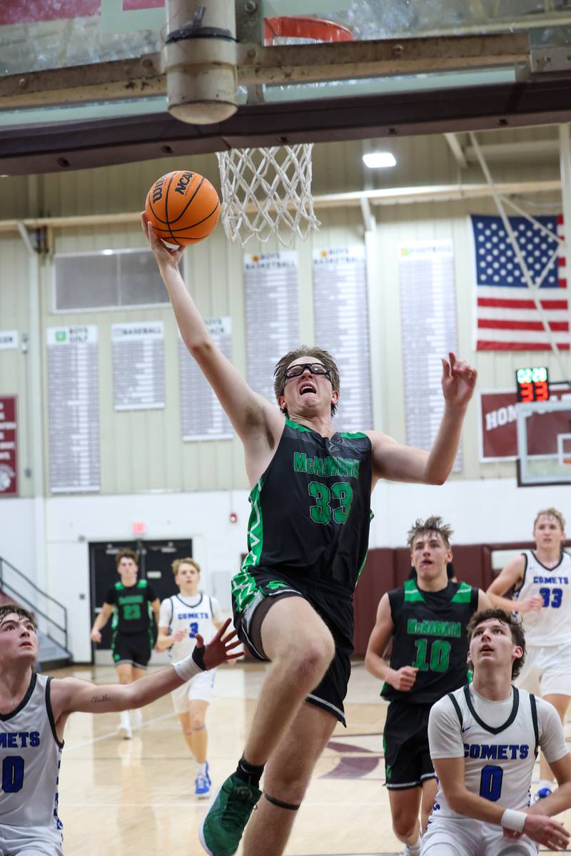Bishop McNamara's Callaghan O'Connor goes up for a dunk past Clifton Central players during the Fightin' Irish's 62-41 victory in the Watseka Holiday Tournament championship on Tuesday, Dec. 16, 2025.