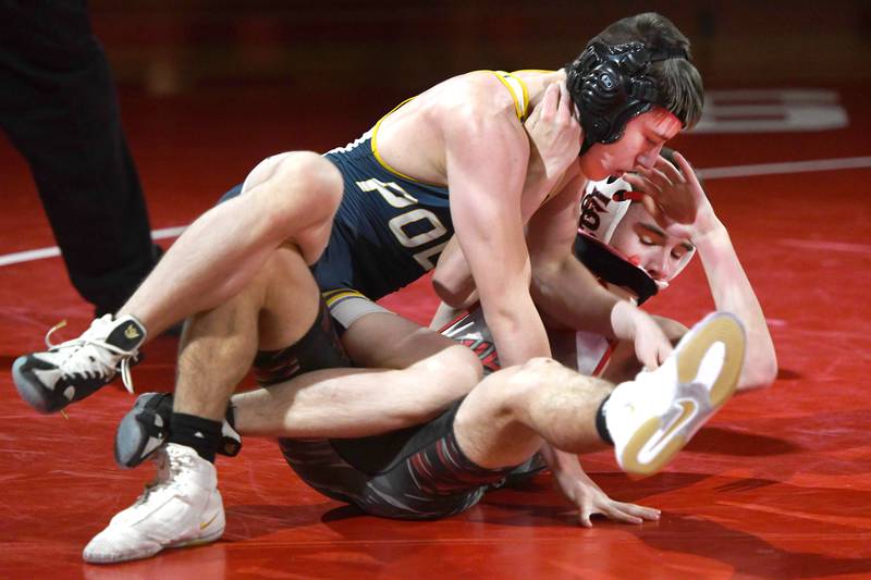 Polo's Gabe Morris and Fulton's Victor Jackson wrestle at 126 pounds during a meet at Oregon High School on Thursday, Dec. 4, 2025.