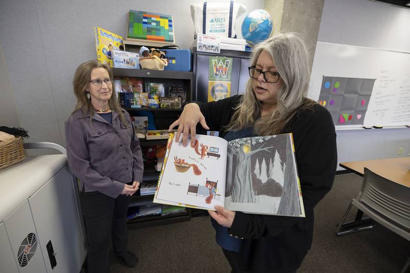 Sauk Valley College professors Beth Smaka (left) and Amanda Eichman talk about the materials used to teach budding teachers might use to inspire young minds.