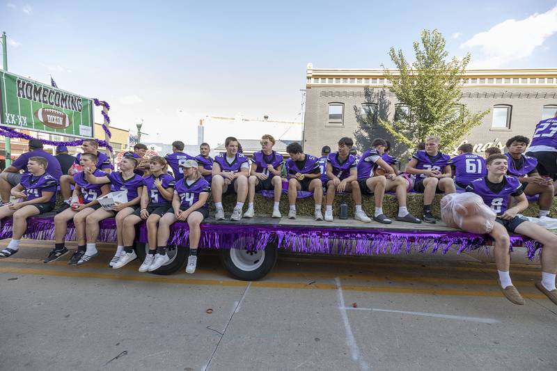 Varsity footballers ride a float Friday, Oct. 3, 2025, in Dixon. The team will later take on the Stillman Valley Cardinals.