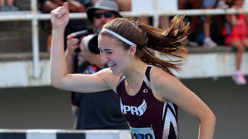 June 12, 2021 - Charleston, Illinois - Prairie Ridge's Rylee Lydon celebrates as she crosses the finish line in the Class 3A 400-Meter Dash at the Illinois High School Association Track & Field State Finals.  (Photo: PhotoNews Media/Clark Brooks)