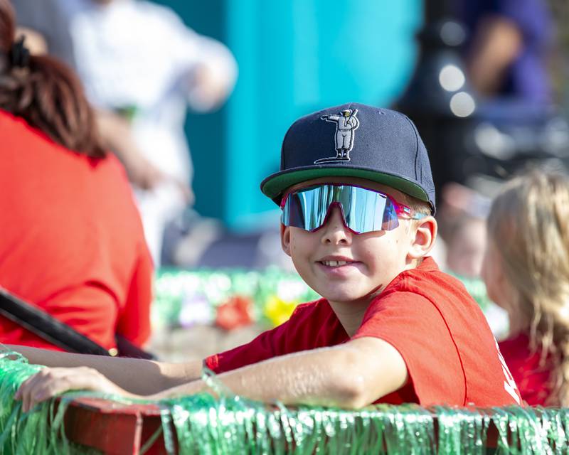 A child rides on the St. Mary Immaculate Catholic School float in the Plainfield Homecoming parade Saturday, Sept 20, 2025.