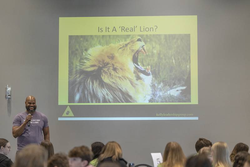 Keynote speaker Dr. Alonzo Kelly speaks with 100 freshmen from area high schools Friday, March 15, 2024, during a student leadership summit hosted by the Regional Office of Education. Kelly spoke to the students about critical thinking and not passively absorbing information.