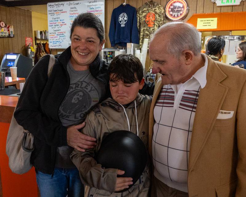 (from left) Angela Walgenbach, son Jameson with tears in eyes and Sam Leone take photo at Sam’s retirement celebration on Saturday, October 25, 2025 at the Rootbeer Stand in Oglesby.