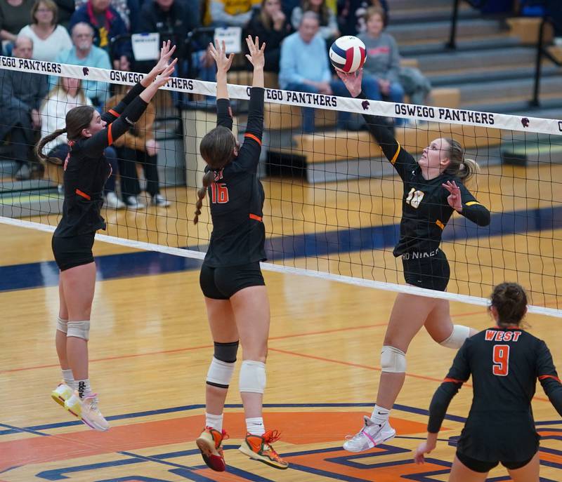 Joliet West's Peyton Darguzis (18) plays the ball at the net against Lincoln-Way West during a class 4A Oswego Sectional semifinal match at Oswego High School on Monday, Oct. 30, 2023.