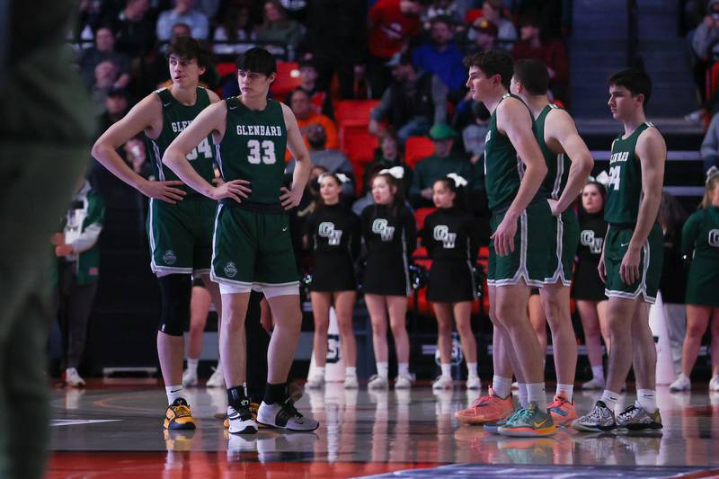 Glenbard West starters wait on the court as the Whitney Young players are introduced in the Class 4A championship game at State Farm Center in Champaign. Saturday, Mar. 12, 2022, in Champaign.