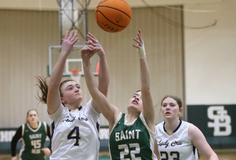 Marquette's Hunter Hopkins and St. Bede's Bailey Engels jump for a rebound during the Class 1A Regional semifinal game on Tuesday, Feb. 18, 2025 at St. Bede Academy.