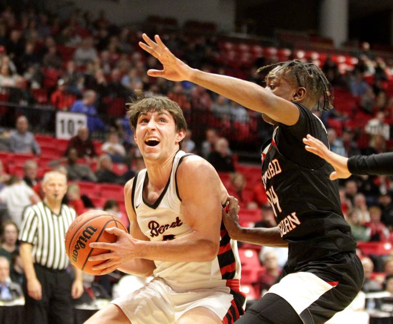 Benet’s Brady Kunka (left) looks for an opening during the Class 4A NIU Supersectional against Rockford Auburn in DeKalb on Monday, March 6, 2023.