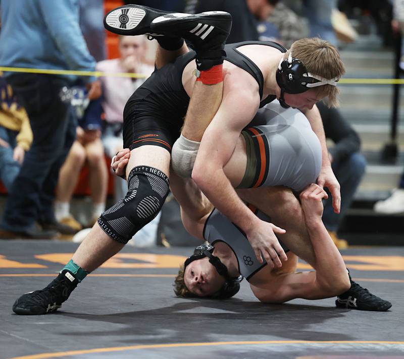 Sandwich’s Joshua Kotalik goes upside down against Byron’s Brody Stein in the 175 pound first place match Saturday, Feb. 14, 2026, during the Class 1A wrestling sectionals in Byron.