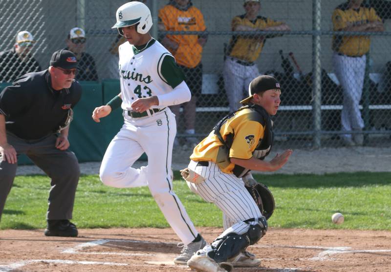 St. Bede's Ranbir Saini steps on home plate as the ball comes in late to Putnam County catcher Traxton Mattingly on Tuesday, April 30, 2024 at St. Bede Academy.