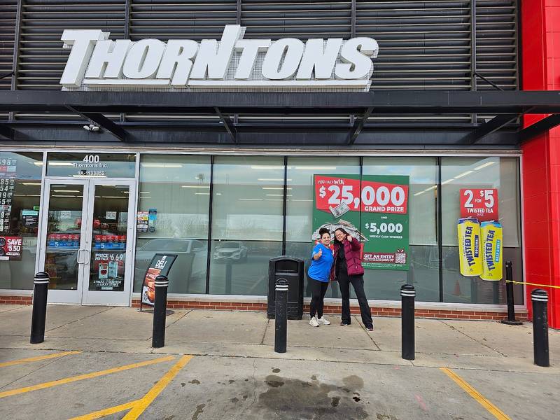 Thorntons’ associates Alexis Kelly (left) and Sarah Skandera share their excitement over selling a $1 million scratch-off ticket at Thorntons, 400 North Independence Blvd. in Romeoville.