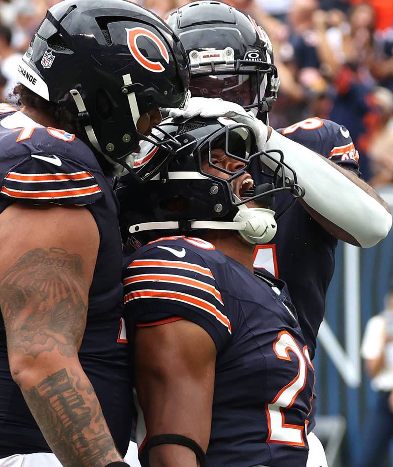 Chicago Bears running back Roschon Johnson (center) celebrates his touchdown run during their game against the Los Angeles Rams Sunday, Sept. 29, 2024, at Soldier Field in Chicago.