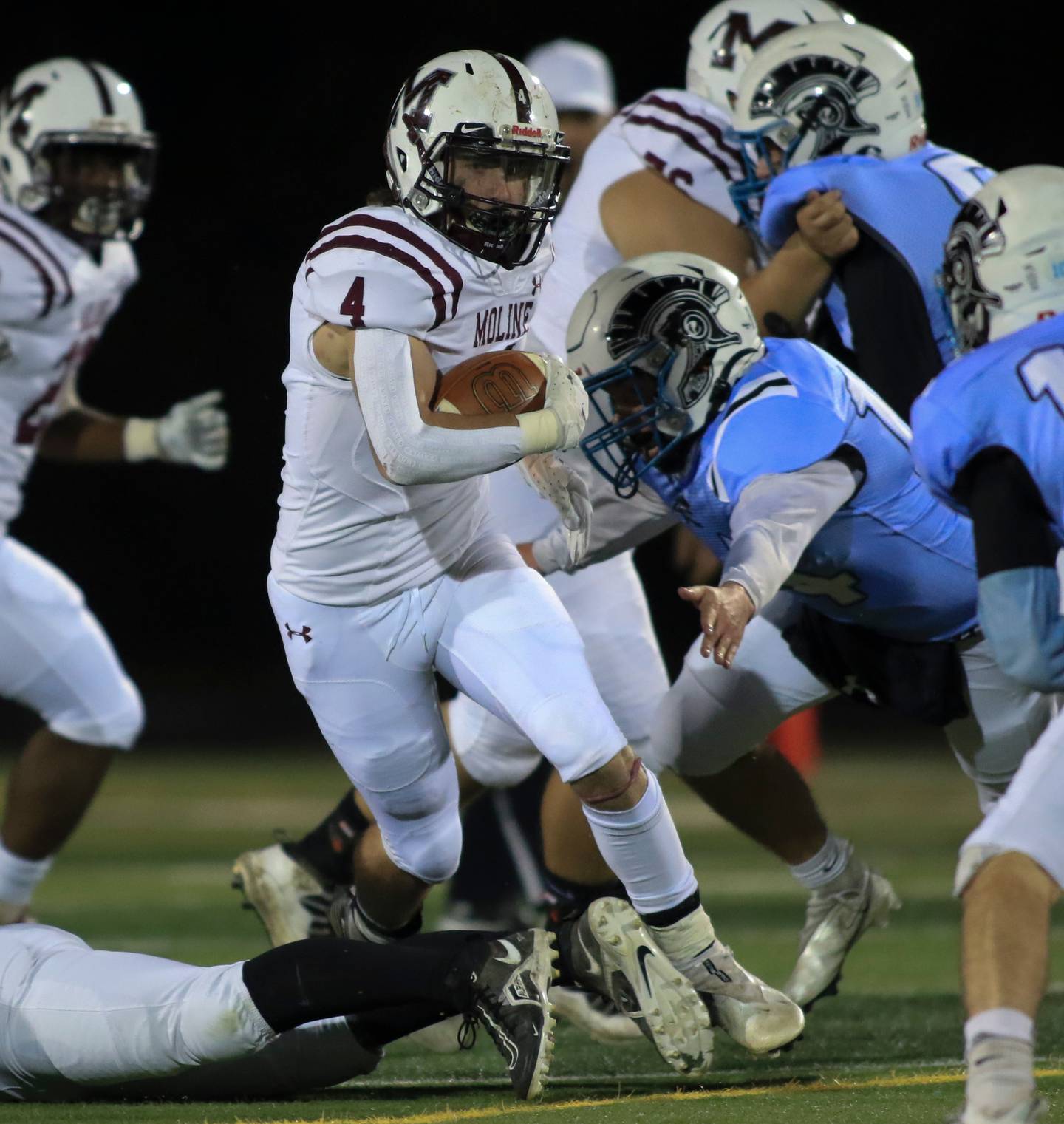 Moline's Riley Fuller (4) runs up the middle during Class 7A second-round game between Moline at Willowbrook on Nov. 5, 2021.