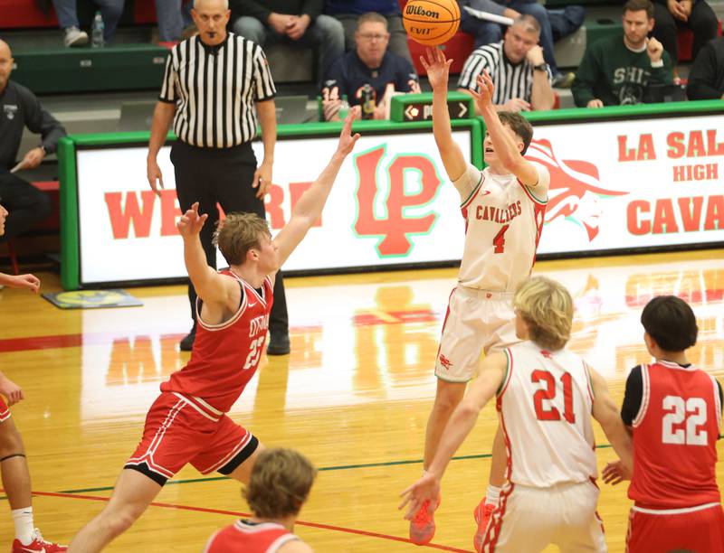 L-P's John Sowers lets go of a jump shot over Ottawa's Owen Sanders on Friday, Jan. 9, 2026 in Sellett Gymnasium at L-P High School.