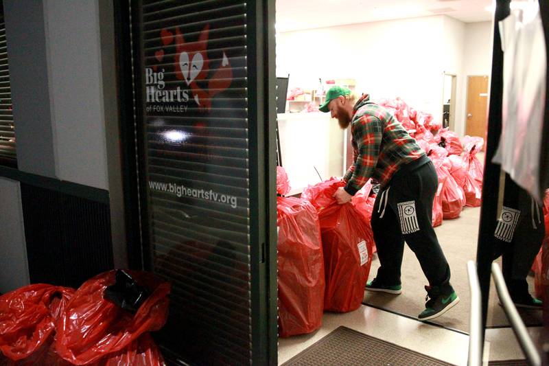 Rick Shales organizes bags full of gifts for 550 St. Charles School District 303 children on Tuesday, Dec. 3, 2024 for the annual Big Hearts of Fox Valley Christmas Gift Sponsorship Program.