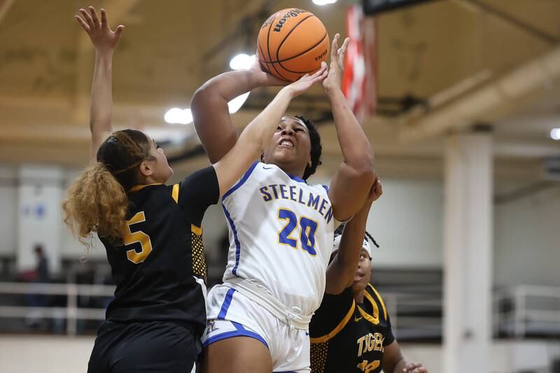 Joliet Central’s Taneisha Robinson puts up a contested shot against Joliet West on Thursday, Jan. 15, 2026 in Joliet.