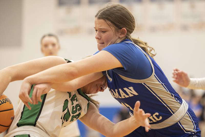 Newman’s Lucy Oetting and Wethersfield’s Camryn Anderson fight for a rebound Thursday, Feb. 26, 2026, in the Class 1A sectional semifinal at Eastland.