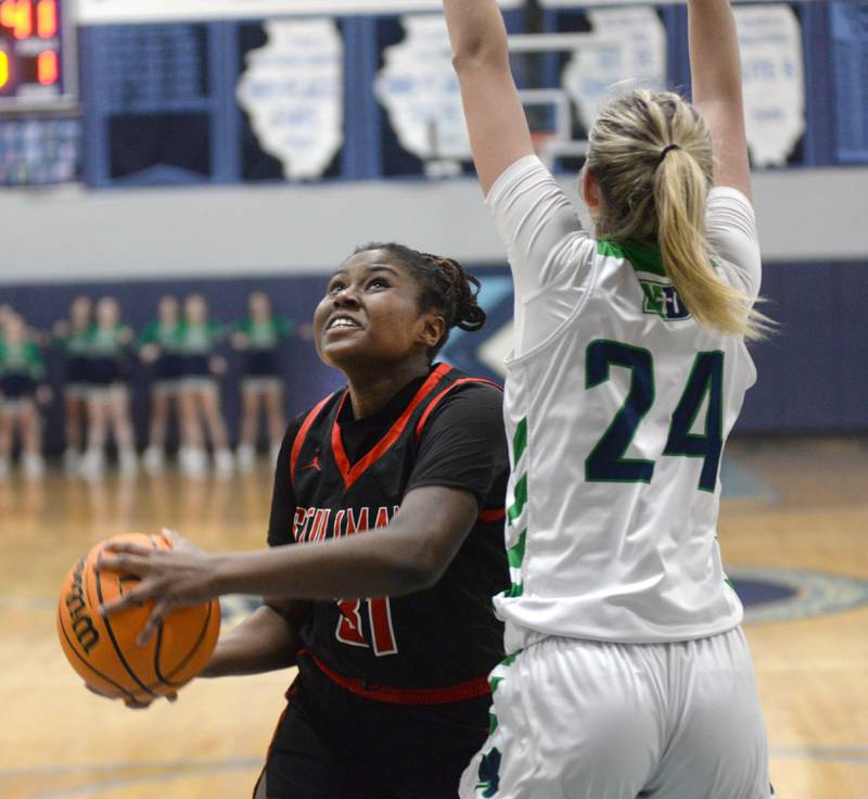 Stillman Valley's Dailene Wade (31) tries to work around Peoria Notre Dame's Lexi Baer (24) during the 2A Super-Sectional on Monday, March 3, 2025 at Bureau Valley High School in Manlius.