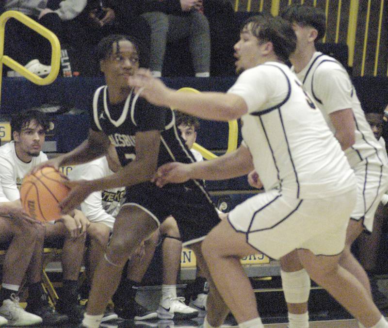 Sterlings Maddux Osborn defends the basket from Galesburg's Keigan Cummer. Sterling Boys Basketball hosted Galesburg at Musgrove Fieldhouse on February 11, 2025.