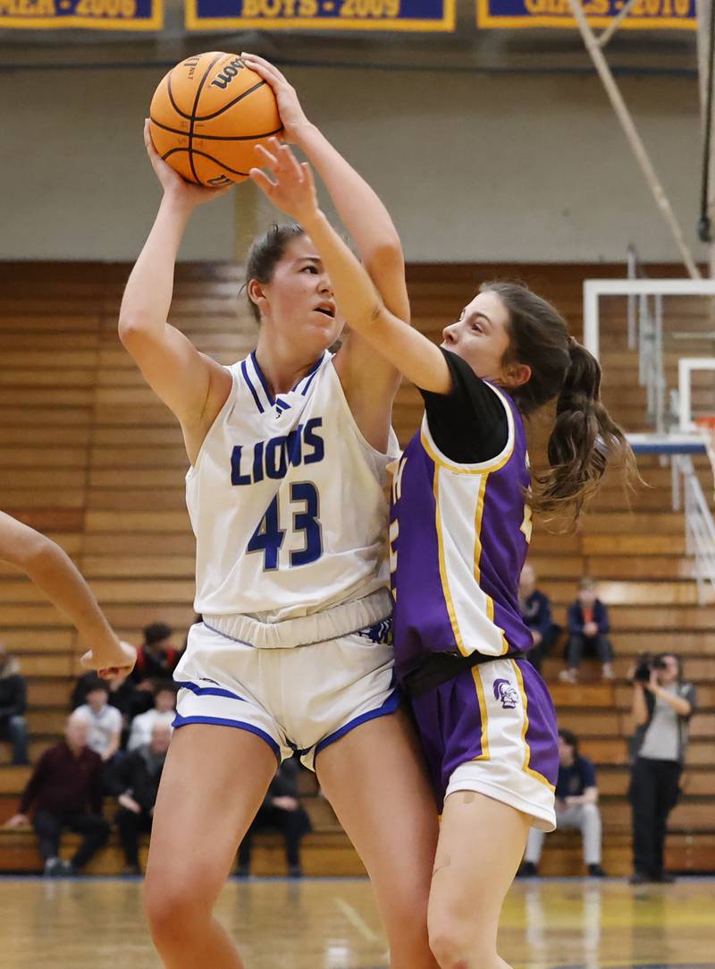 Lyons' Emma O'Brien (43) looks to pass the ball during the girls varsity basketball game between Downers Grove North and Lyons Township on Saturday, Jan. 11, 2025 in La Grange.