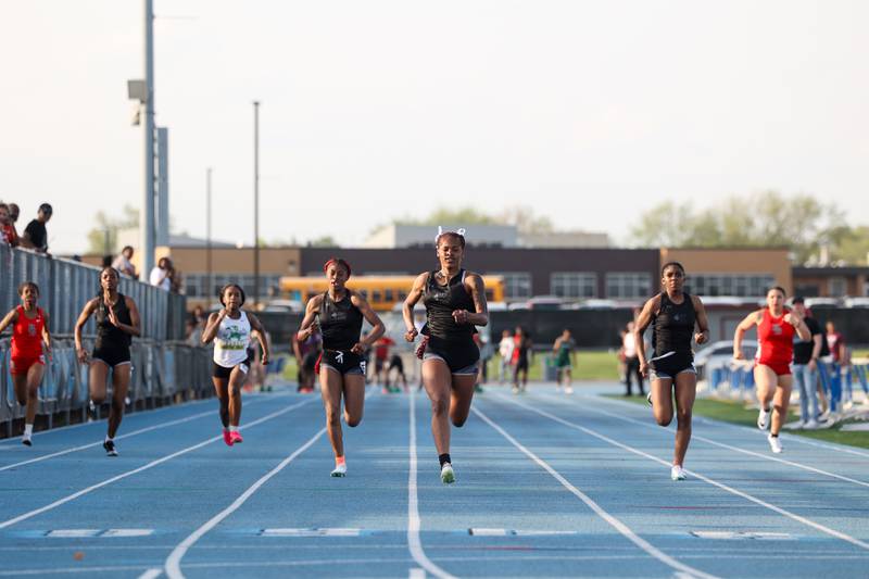 Kankakee's Trinity Noble, center, keeps her lead to take first place in the girls 100 meters during the All-City meet at Kankakee High School on Monday, April, 28, 2025.