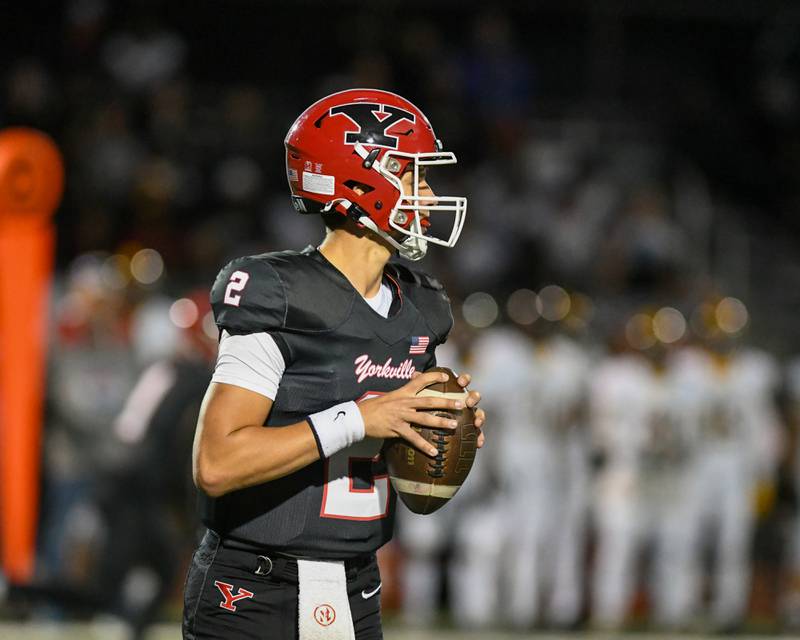Yorkville's Jack Beetham (2) looks for an open teammate during the game on Friday Sept. 5, 2025, while taking on Joliet West.