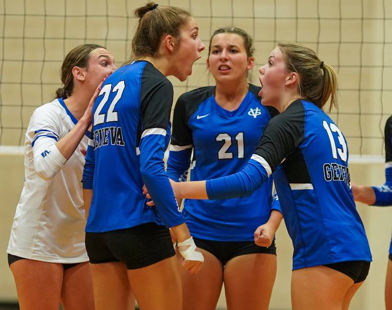 Geneva’s Charlotte Potvin (22), Grace Waters (21) and Bridget Feichter (13) react after scoring a point against Wheaton Warrenville South after scoring a point against Wheaton Warrenville South during a volleyball match at Geneva High School on Tuesday, Sep 5, 2023.