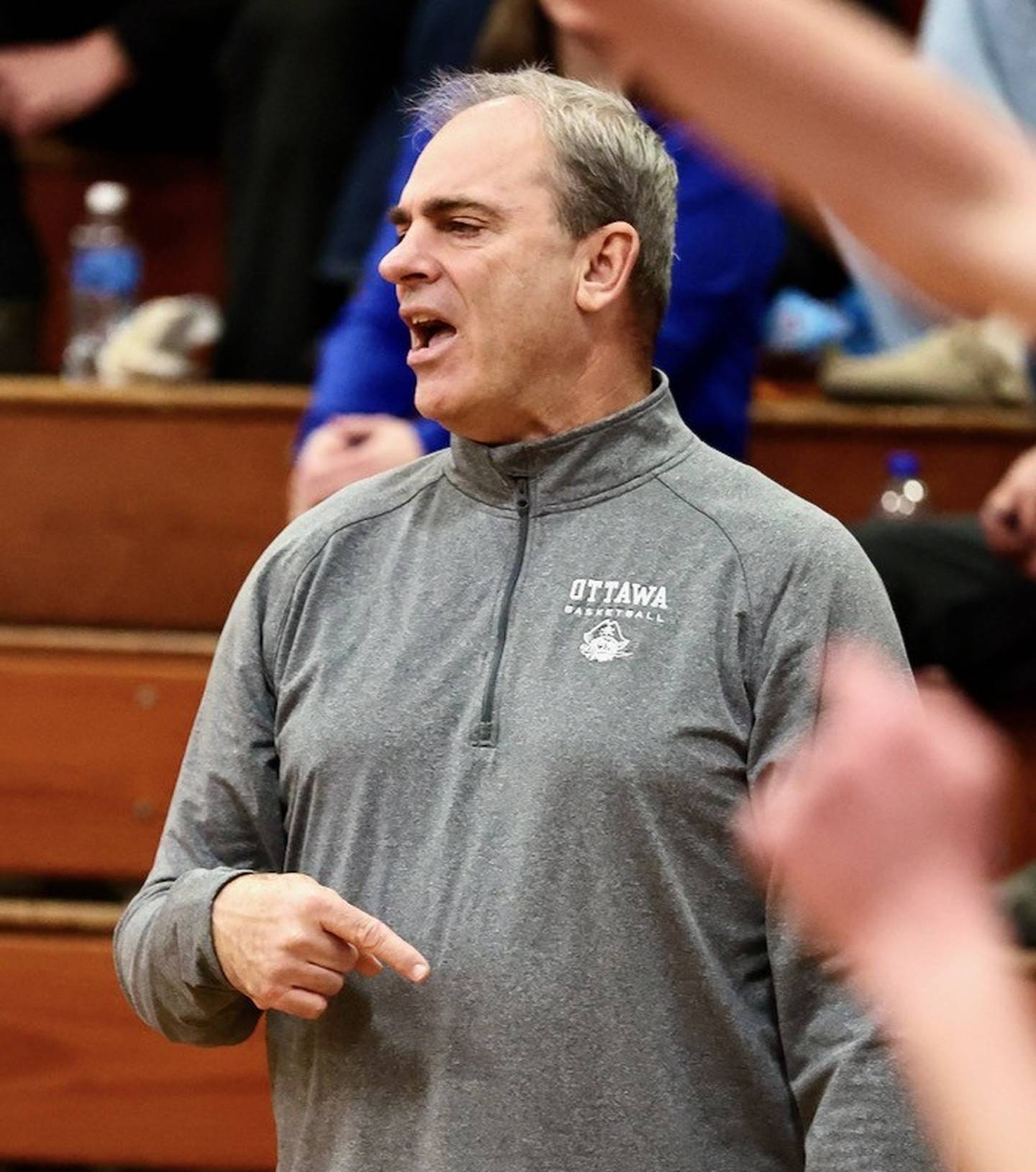 Ottawa's Mark Cooper coaches during Tuesday's game at Princeton. He reflected on his memories playing and coaching at Prouty Gym after what stands to be his final game.