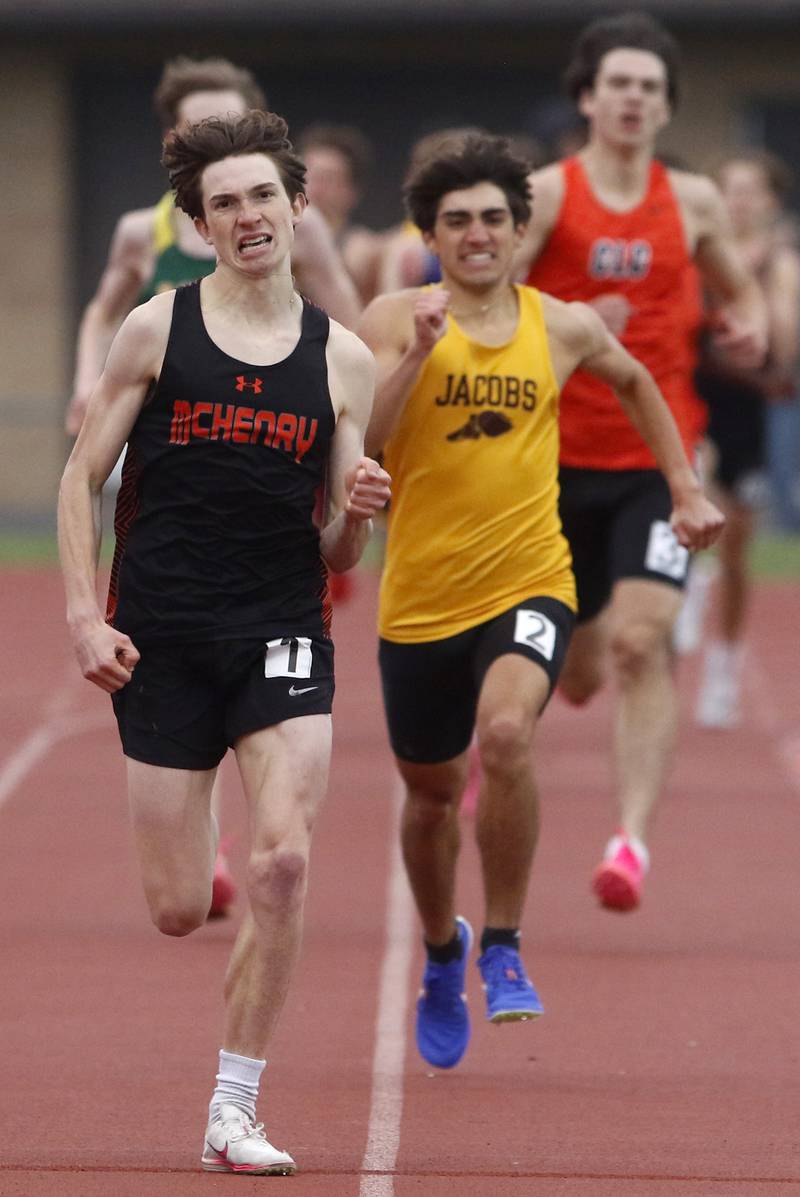 McHenry’s Doug Martin oust sprints Jacobs’ Matthew Andreano to win the 800 meter run during the Fox Valley Conference Boys Track and Field Meet on Thursday, May 9, 2024, at Huntley High School.