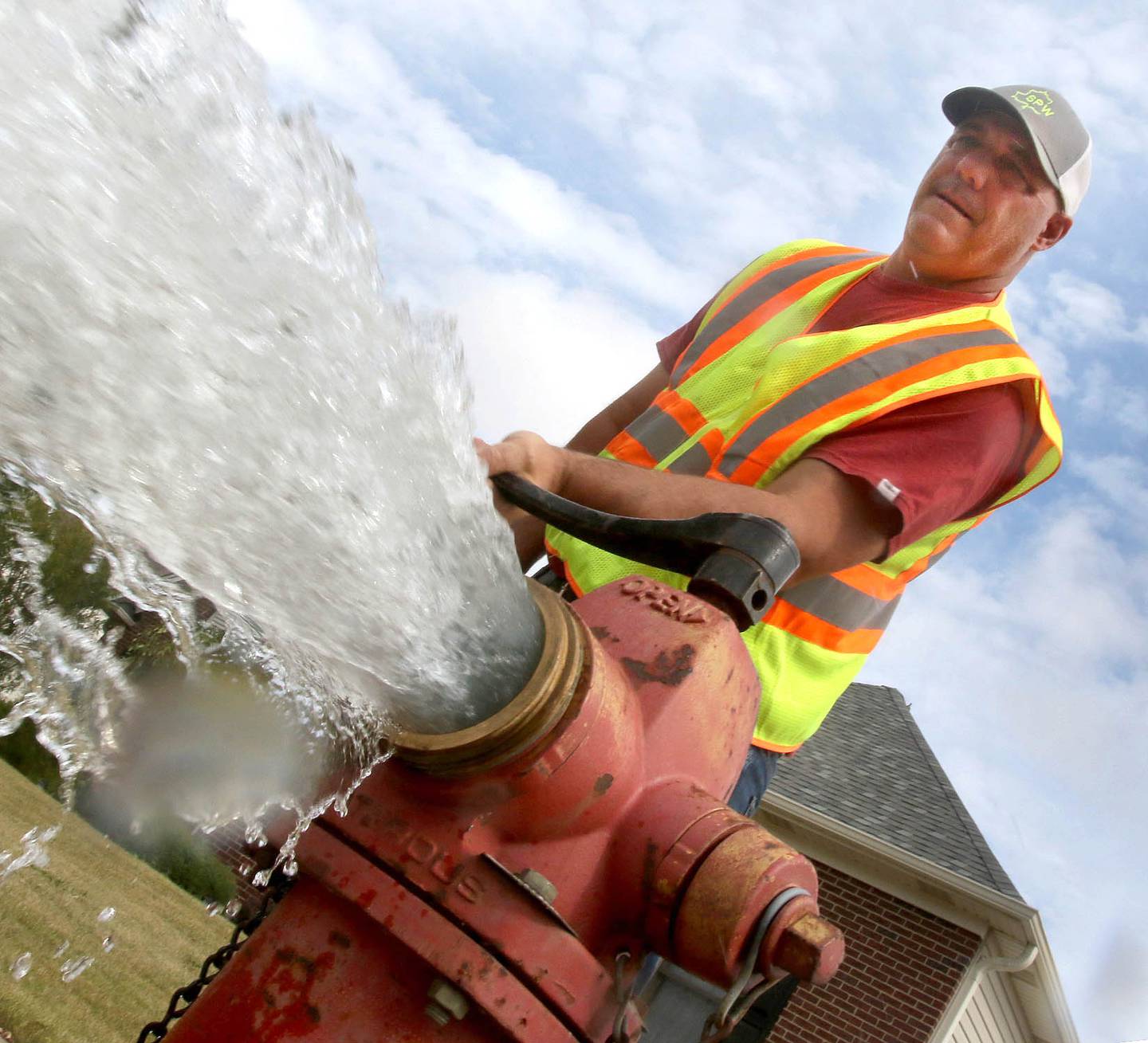 Bryan Carlson, a Sycamore Public Works employee flushes a fire hydrant Tuesday, Sep. 21, 2021, on Briggs Street in Sycamore.