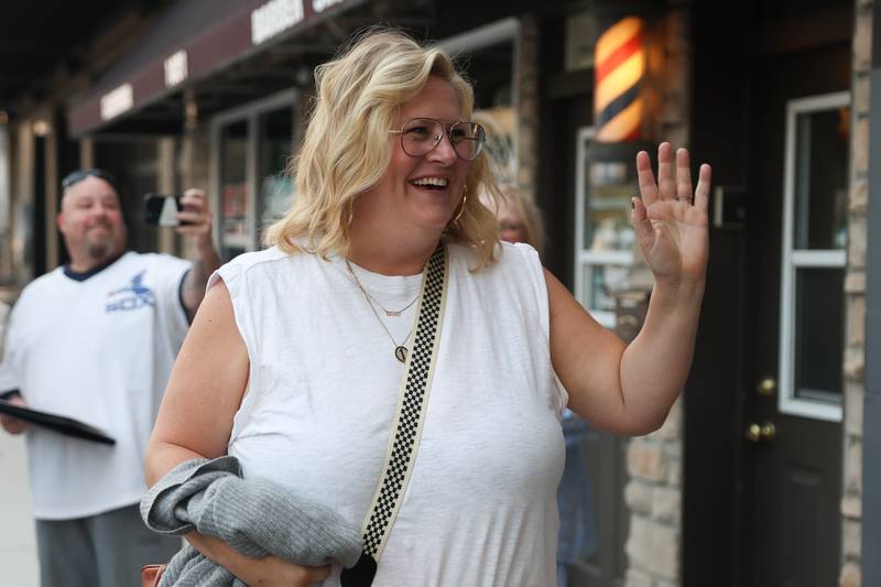 Actor Bridget Everett waves as she arrives for the HBO premiere of Somebody Somewhere at Roxy Lockport on Wednesday, Oct. 30, 2024 in Lockport.