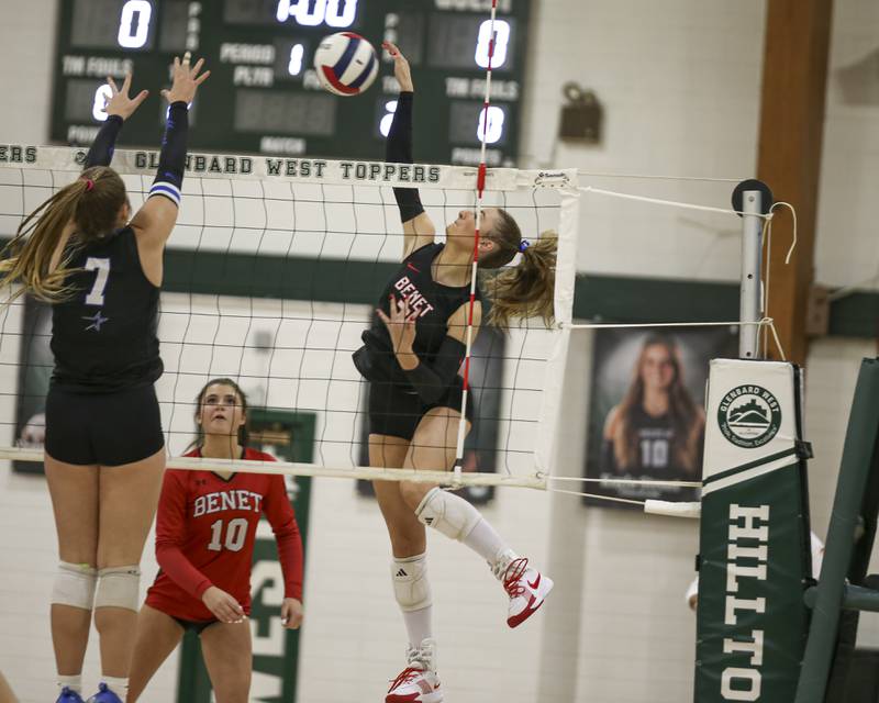 Benet's Sophia Chinetti (7) goes after a kill during Class 4A Glenbard West Sectional final volleyball match between St Charles North at Benet. Nov 6, 2025 in Glen Ellyn.